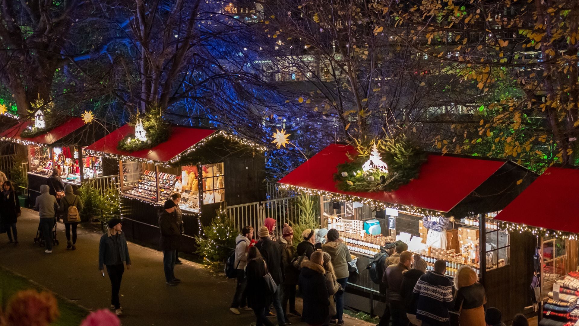 People walking and shopping in Edinburgh Christmas Market, United Kingdom