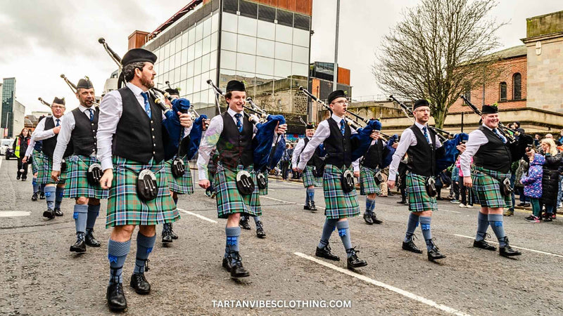 Pipe band marching and playing in Saint Patrick's Day parade in Belfast.